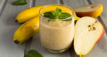 Smoothie,,Bananas,And,Pear,On,The,Grey,Background